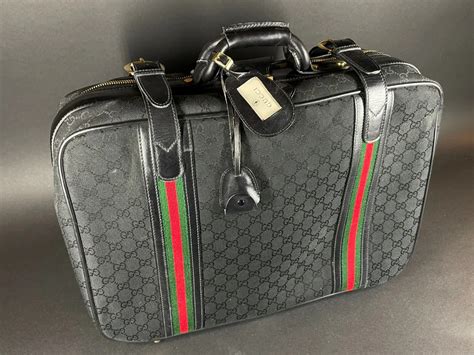 gucci black courts|gucci luggage sale.